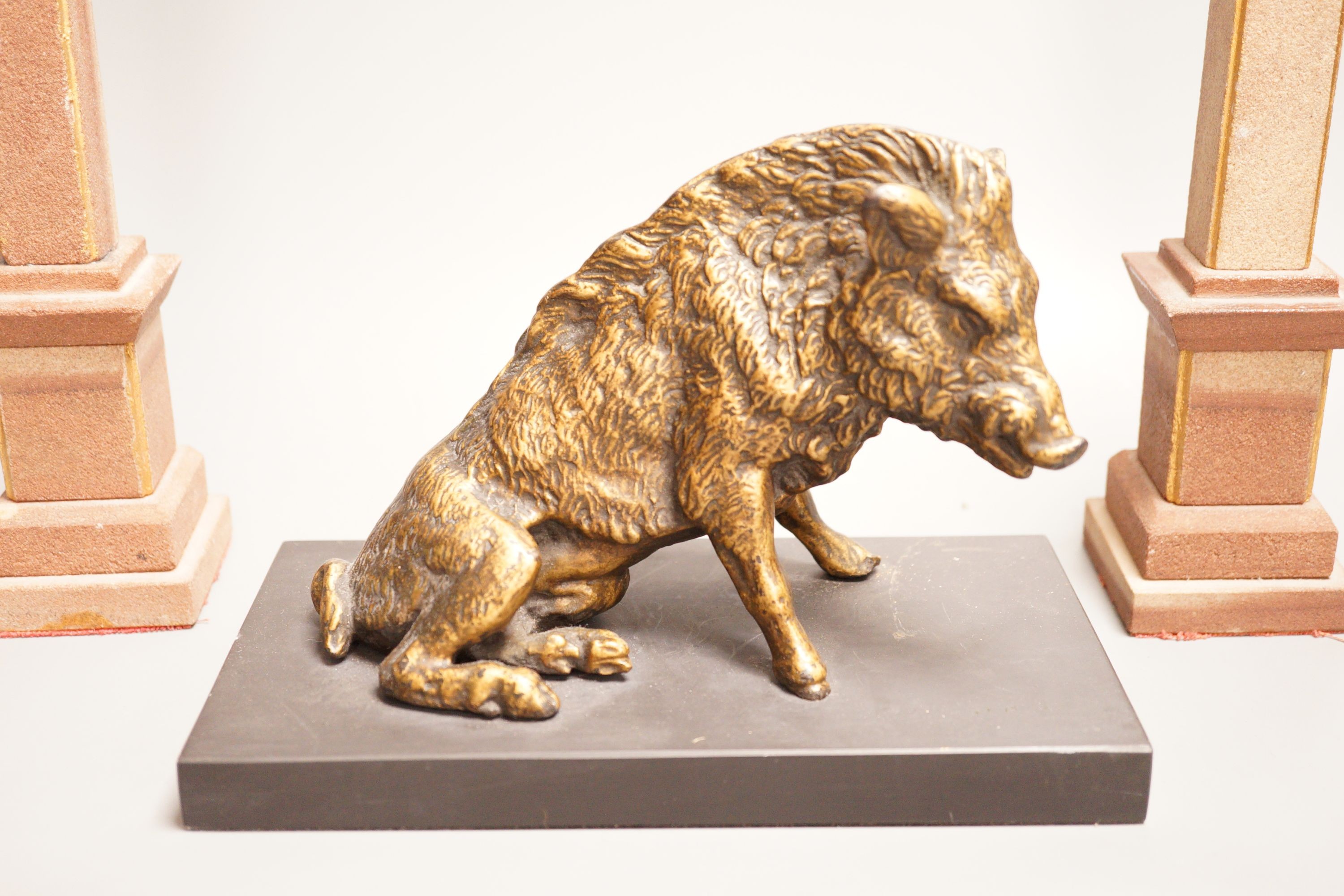 After the antique, a bronzed composition model of the Borghese boar together with a pair of reconstituted stone obelisks, 28cm